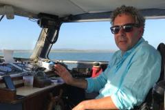 1594812235-adam-on-boat