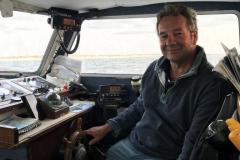 1599908327-adam-driving-boat